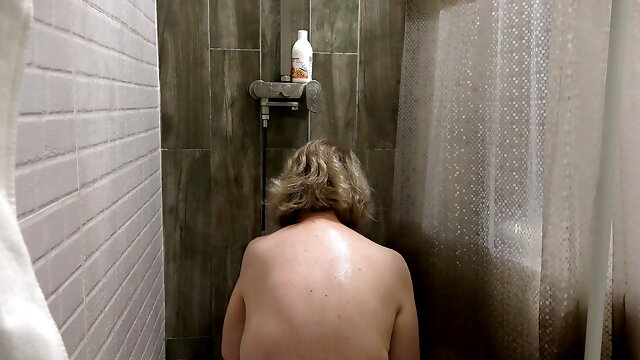 The camera in the shower is watching a curvy MILF. Mature bbw washes fat ass, big boobs, hairy pussy. PAWG. Amateur fetish. BBW.