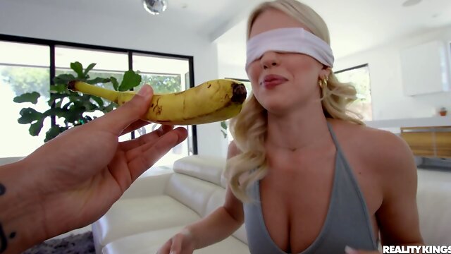 Blind folded blonde babe fitted with a dick thats thick enough to gag her