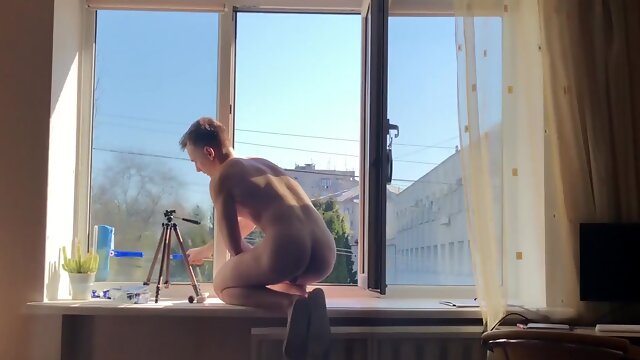 Young Total Bare Window Cleaner Washes Windows in the Morning