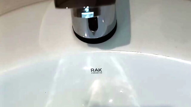 Risky cumshot in women's toilet sink in English hotel