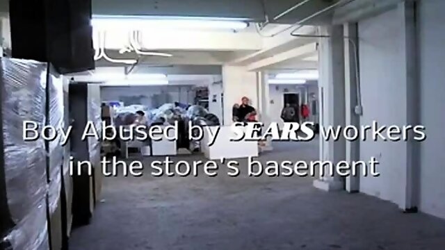 Boy by SEARS workers in the stores basement