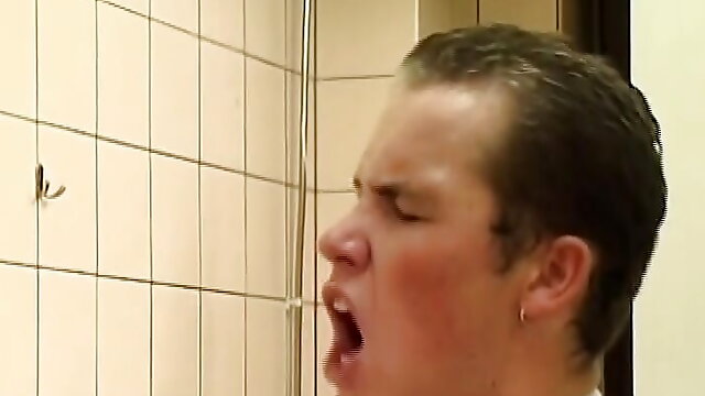 Wild German lady gets pissed and fucked in the bathroom by a long cock