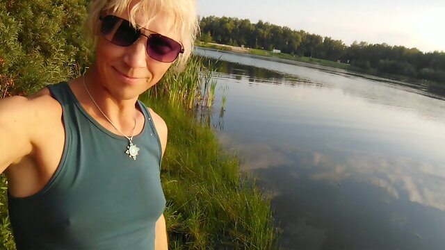 Swimming in the lake in fitness wear at sunset.. Moist stretch pants and t-tee-shirt...