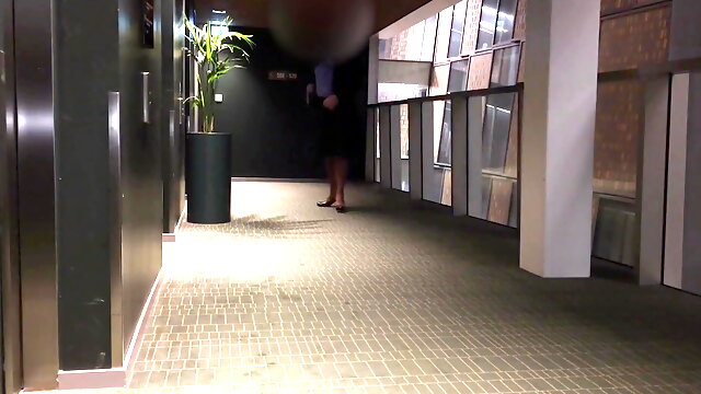 Crossdresser having Dildo fun in front of hotel elevators