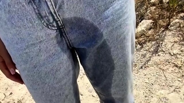 Wild girl drops her piss soaked pants and sucks cock outside