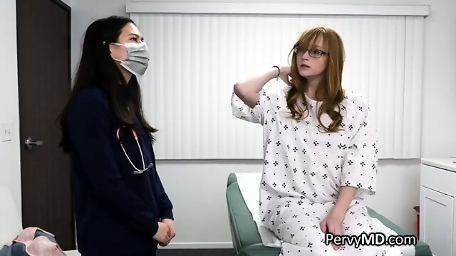 Cute redhead rides the doctors cock on the exam table