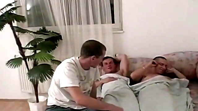 Bold twink takes on two hard cocks same time