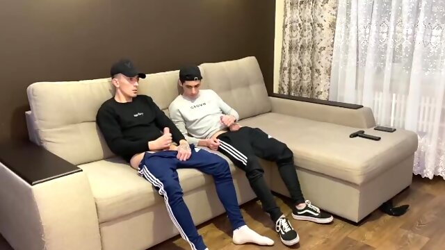 Two friends jerk off in sporwear and cum