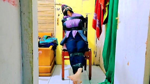 Hijab Indo Taped to a Chair