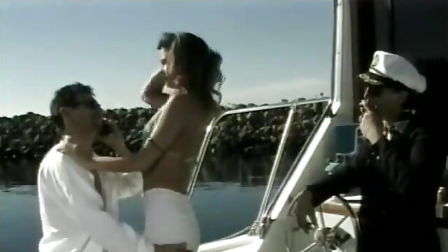 Horny dude fucks a gorgeous brunette MILF with perky tits in the cabin of his yacht