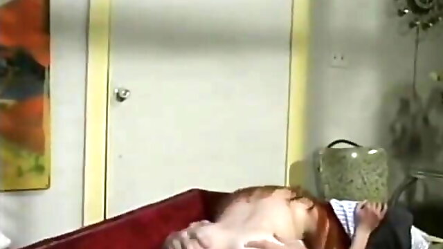Long-haired red head gags on stiff thick cock