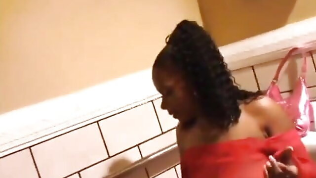 Watcher's view of two different ebony whores urinating in the bathroom