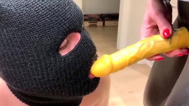 Milf mistress makes masked slave worship strapon dildo