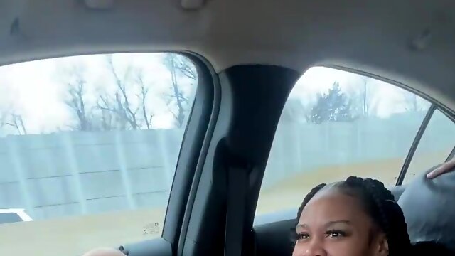 Black chick publicly fucks her hot pussy with a dildo while riding in a car.