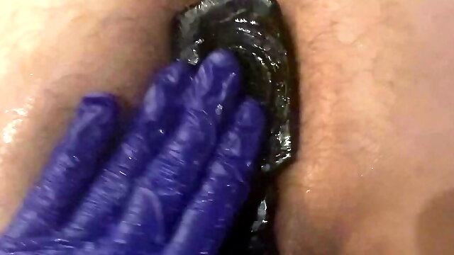 Milking daddy's ass with a toy from behind leaky cock