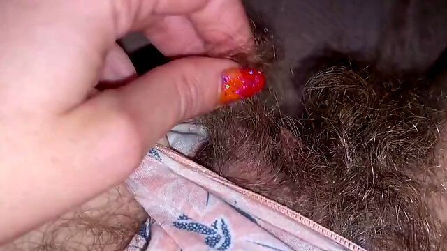 Closeup of huge clit head and hairy pussy