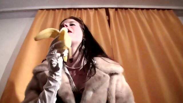 Spex brunette talking dirty while eating banana by Femdom Austria