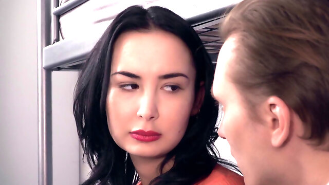 Dirty brunette blows a horny stranger in the hostel room