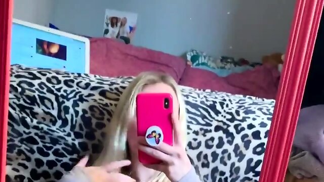 Hot and horny blonde films herself fingering her pussy