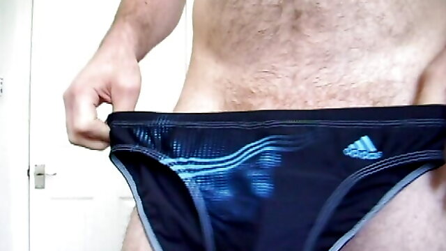 Trying on speedo and adidas swim trunks briefs. Masturbate and cum in speedo then put them on. 