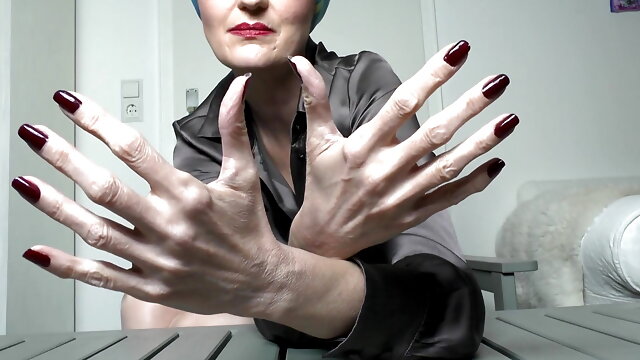 Long Dark Red Fingernails and Fist Hand