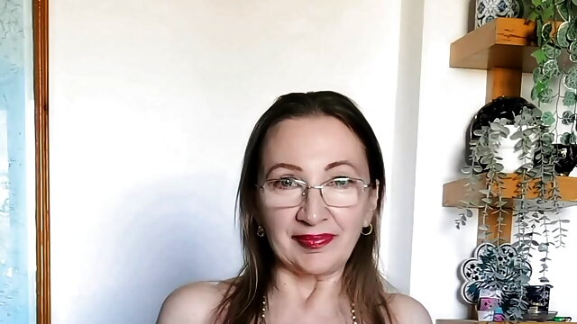 Busty hot granny MariaOld in glasses teasing by shaking huge boobs