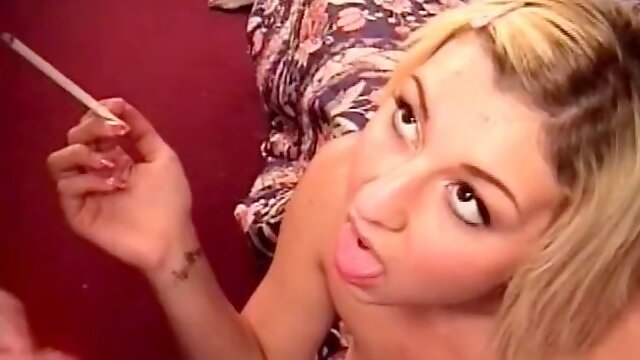 Blonde slut gets cum in her mouth while smoking