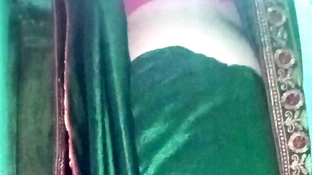Indian gay Crossdresser Gaurisissy in Green Saree pressing her big Boobs and fingering in her ass