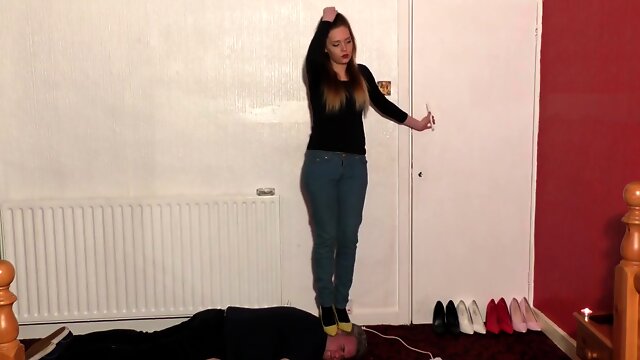 High-heeled Babe Dances And Tramples Slaves Head