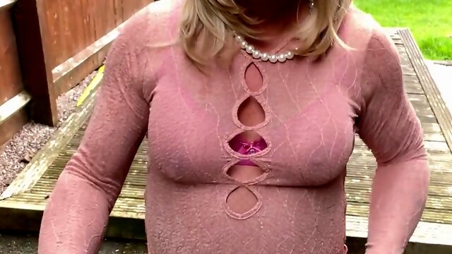 First-timer crossdresser Kellycd2022 sexy milf urinating her little rosy panties in fishnet pantyhose and heels outdoors in the garden