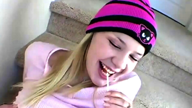 Blonde teen in pantyhose seduces with a lollipop while teasing you on the stairs