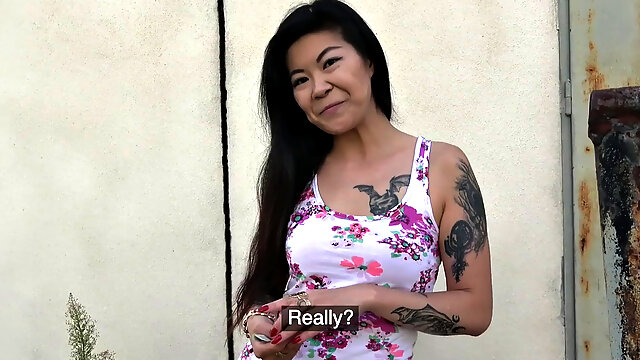 A tattooed Asian babe moan with pleasure as she gets girthy and takes it from behind