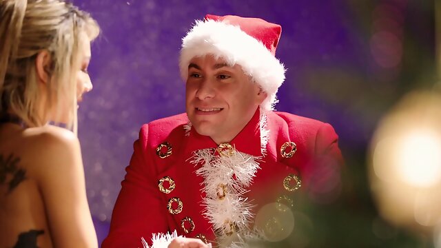 Aroused blonde plays erotic with her Santa in a midnight porn