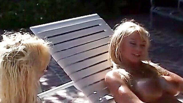 Two Busty MILFs Fuck Their Pussies with a Big Strapon After Oiling Their Bodies Outside