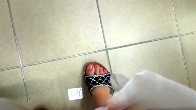 Wonderful sexy feet in the shoe shop trying on sandals would you like to suck them all?