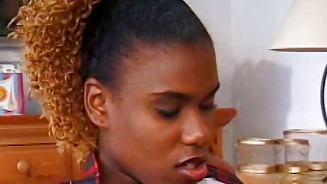 Young chocolate girl with curly hair gets facial after good drilling