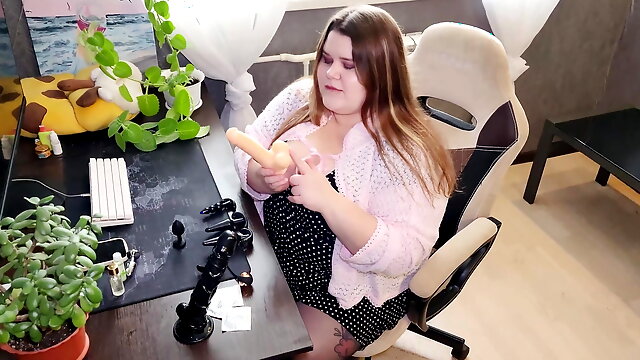 Russian Sex Shop Chubby Assistant Shows a Collection of Dildos and Anal Plugs