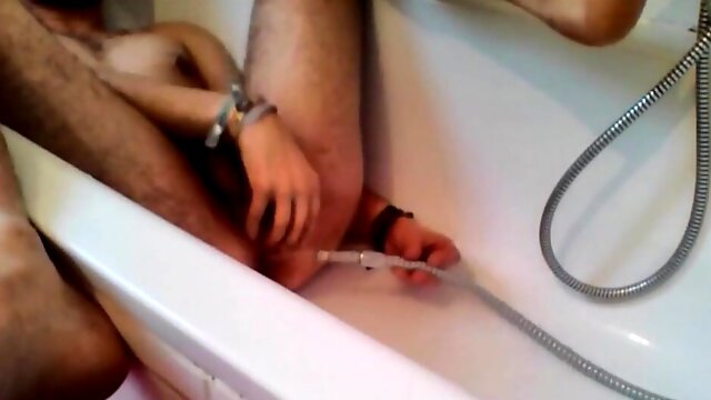 Bi-guy using shower head, squirting water, enema 6