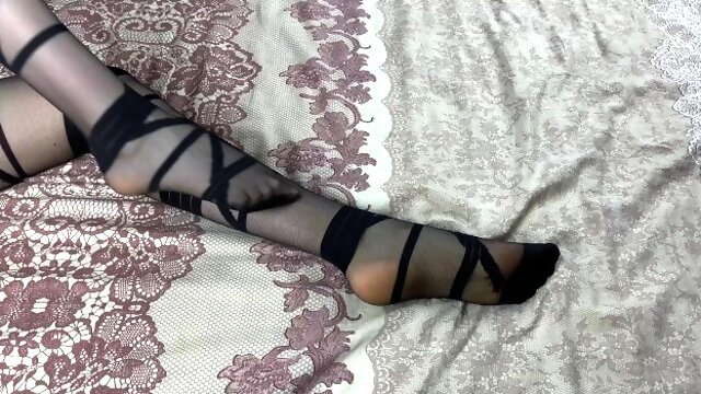 Long legs in black stockings, best girl caresses in bed
