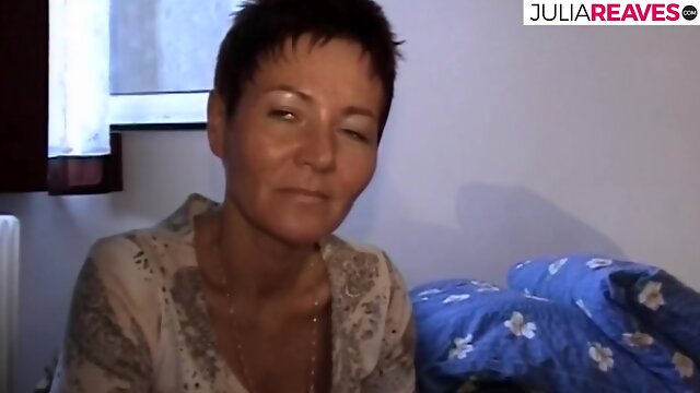 Mature brunette does it to herself after showering
