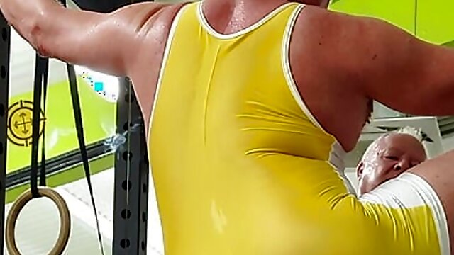 Sweaty and revealing in the gym in a see-thru singlet