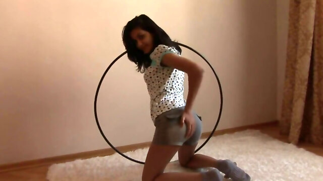 Hula hoop hottie petting her juicy pussy on the floor