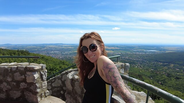 Tattooed Mom is hiking in the woods. She enjoys summer and outdoor nudity